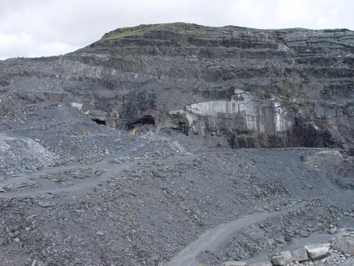 Quarry operative runs for cover from fly ash in blasting at Cwt-y-Bugail slate quarry